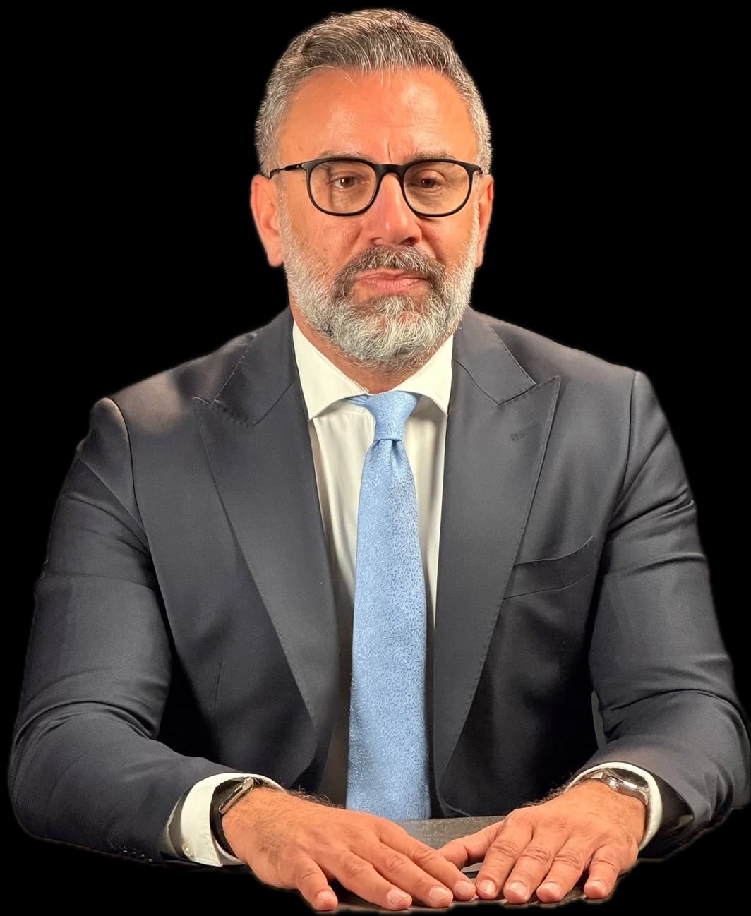 Ghassan Obeid, founder of Riches & Guards, seated in a dark suit.